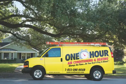A One Hour Air Conditioning Van outfront a home in Minnesota. Heater Replacement